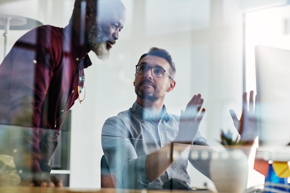 Business People Collaborate On Computer